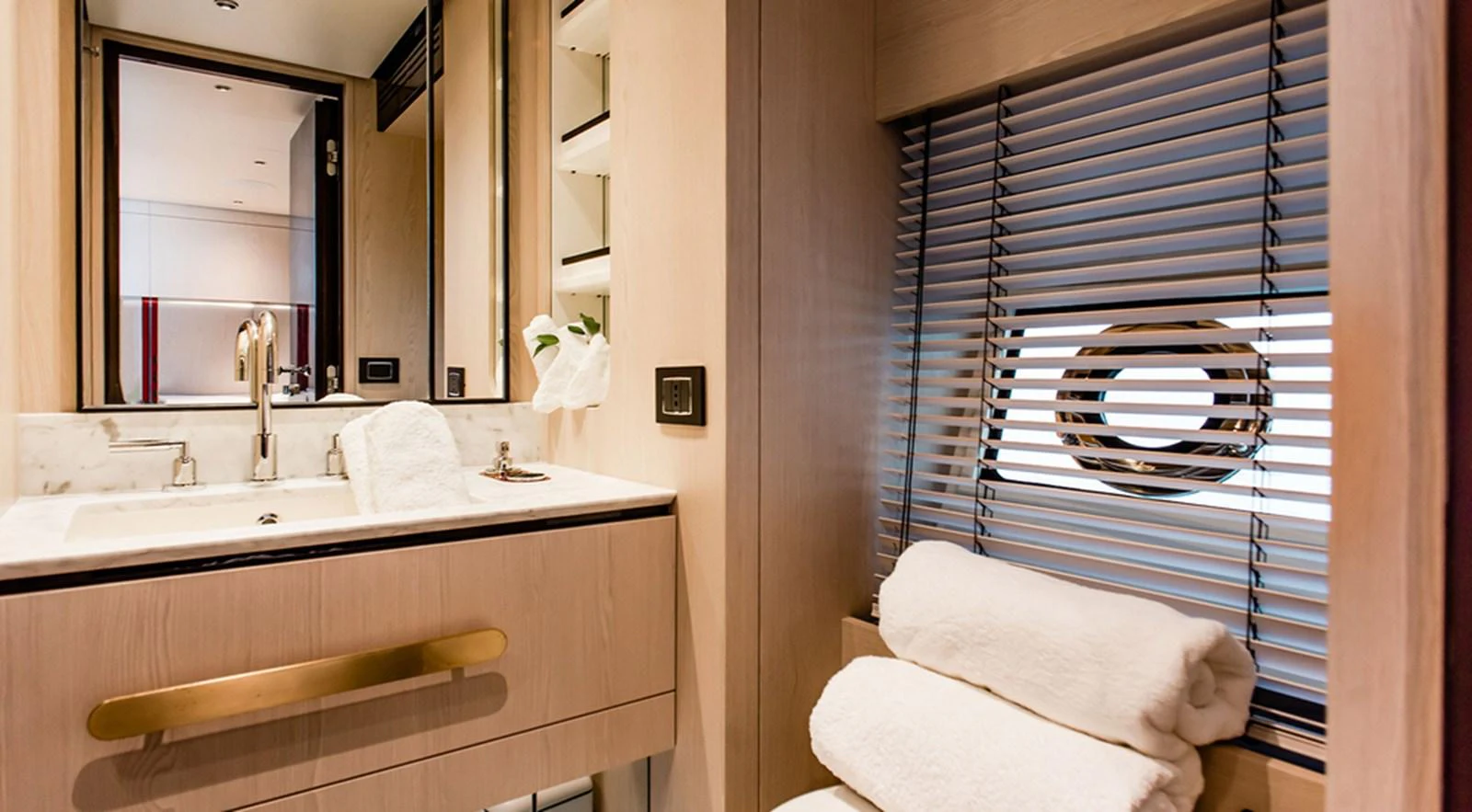 The yacht's bathroom features modern fixtures and a clean, elegant design. aboard LASTOCHKA Yacht for Sale