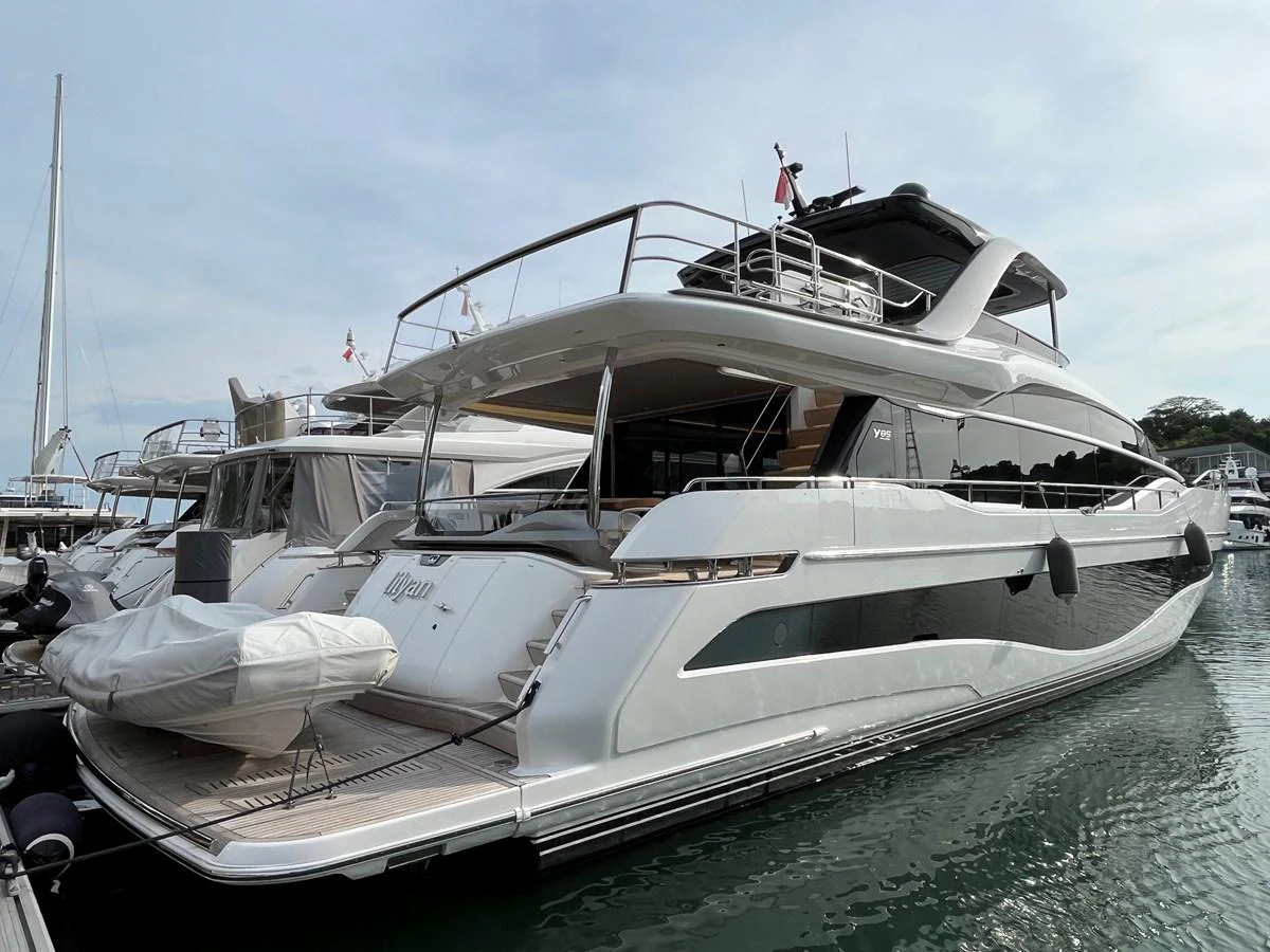 A sleek and modern yacht is docked at the marina, showcasing its elegant design and spacious decks. aboard LILYAN Yacht for Sale