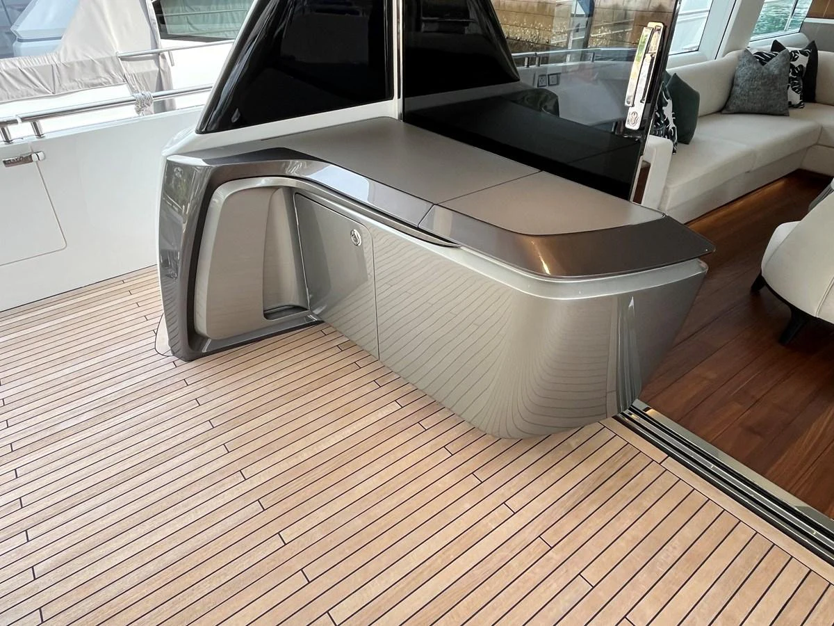 A sleek, modern bar area on the yacht's deck, featuring polished surfaces and elegant design. aboard LILYAN Yacht for Sale