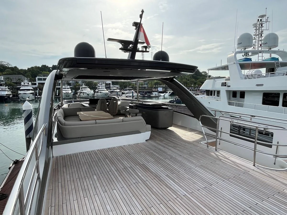 The flybridge offers a spacious and inviting area for relaxation and socializing, with ample seating and a sleek design. aboard LILYAN Yacht for Sale
