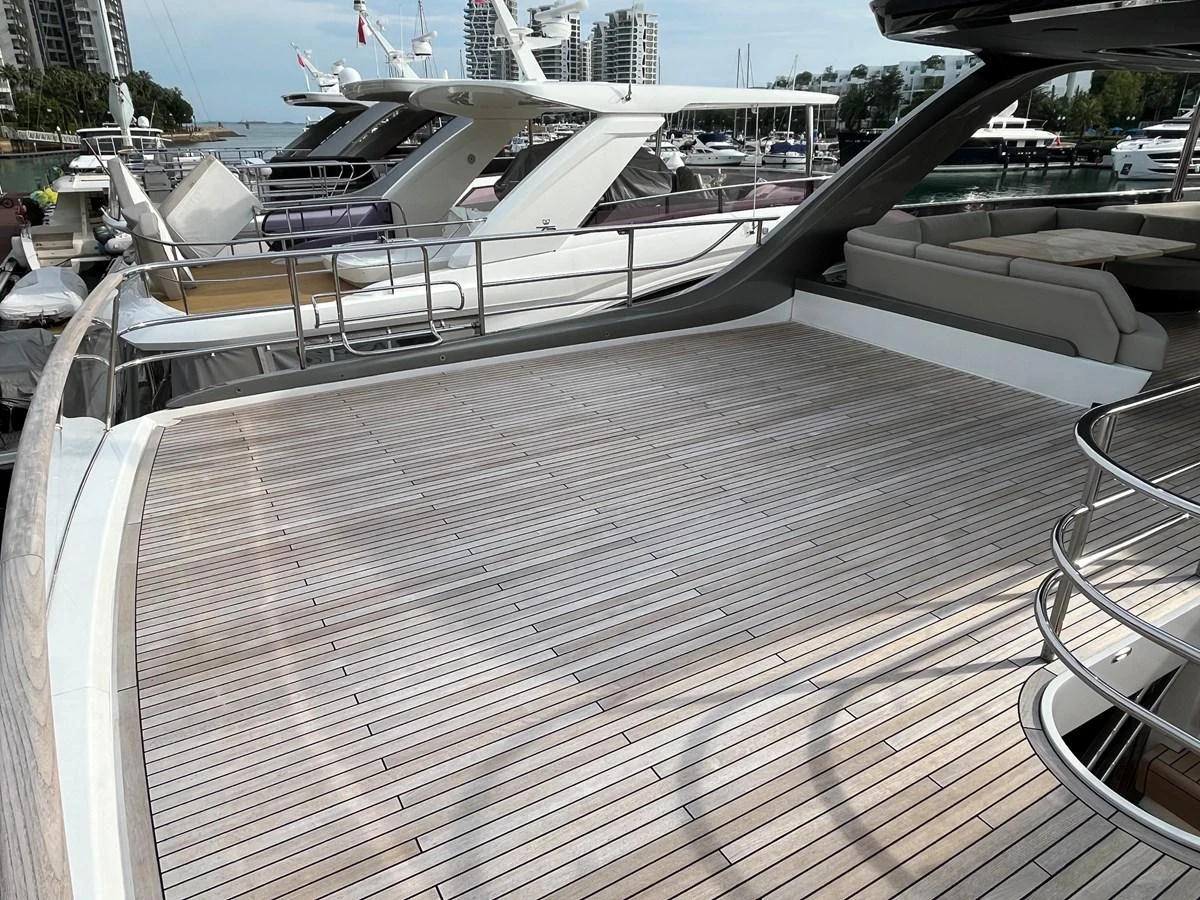 The spacious aft deck features elegant teak flooring and ample seating for relaxation. aboard LILYAN Yacht for Sale