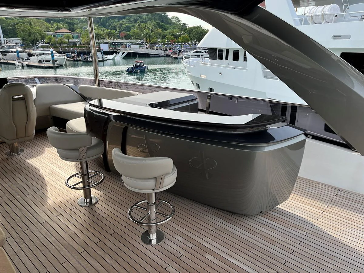 The yacht features a stylish bar area with modern seating and a sleek design, perfect for entertaining guests. aboard LILYAN Yacht for Sale