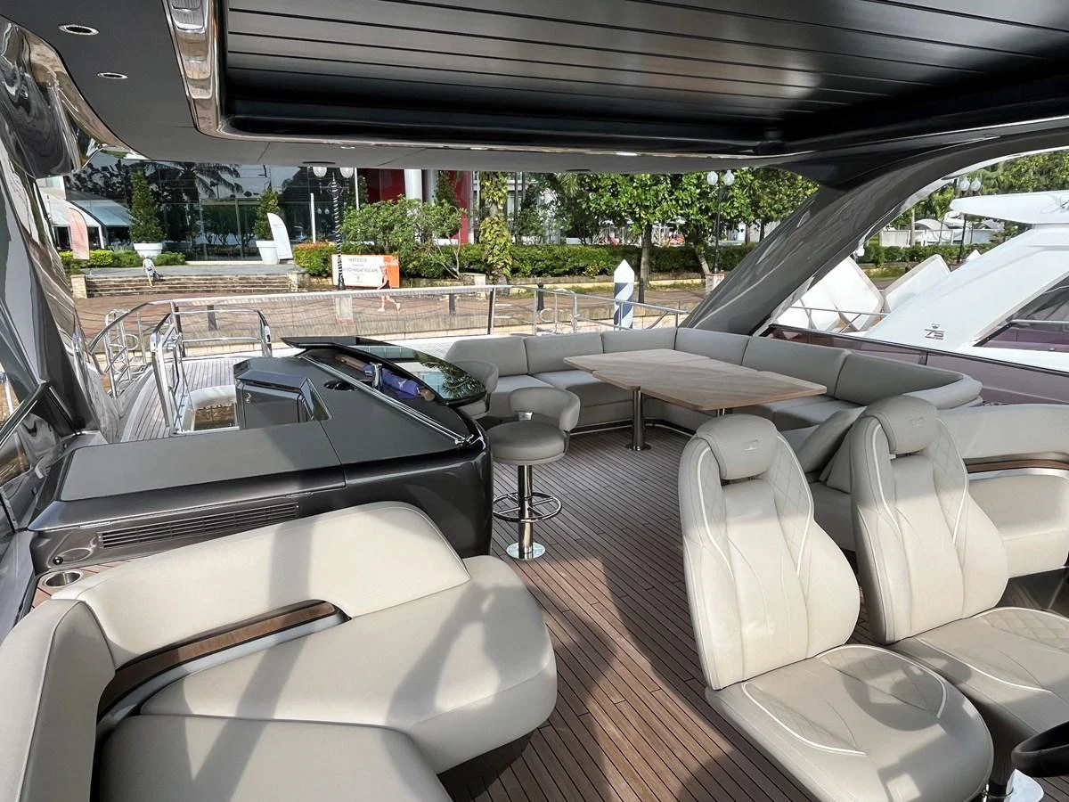 The aft deck features luxurious seating and a dining area with a sleek, modern design. aboard LILYAN Yacht for Sale