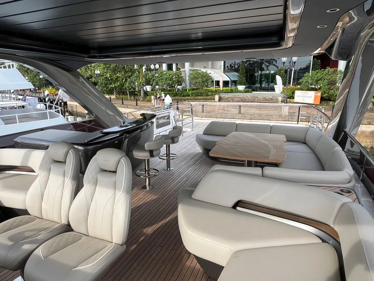 The aft deck features luxurious seating and a stylish bar area, perfect for relaxation and entertainment. aboard LILYAN Yacht for Sale