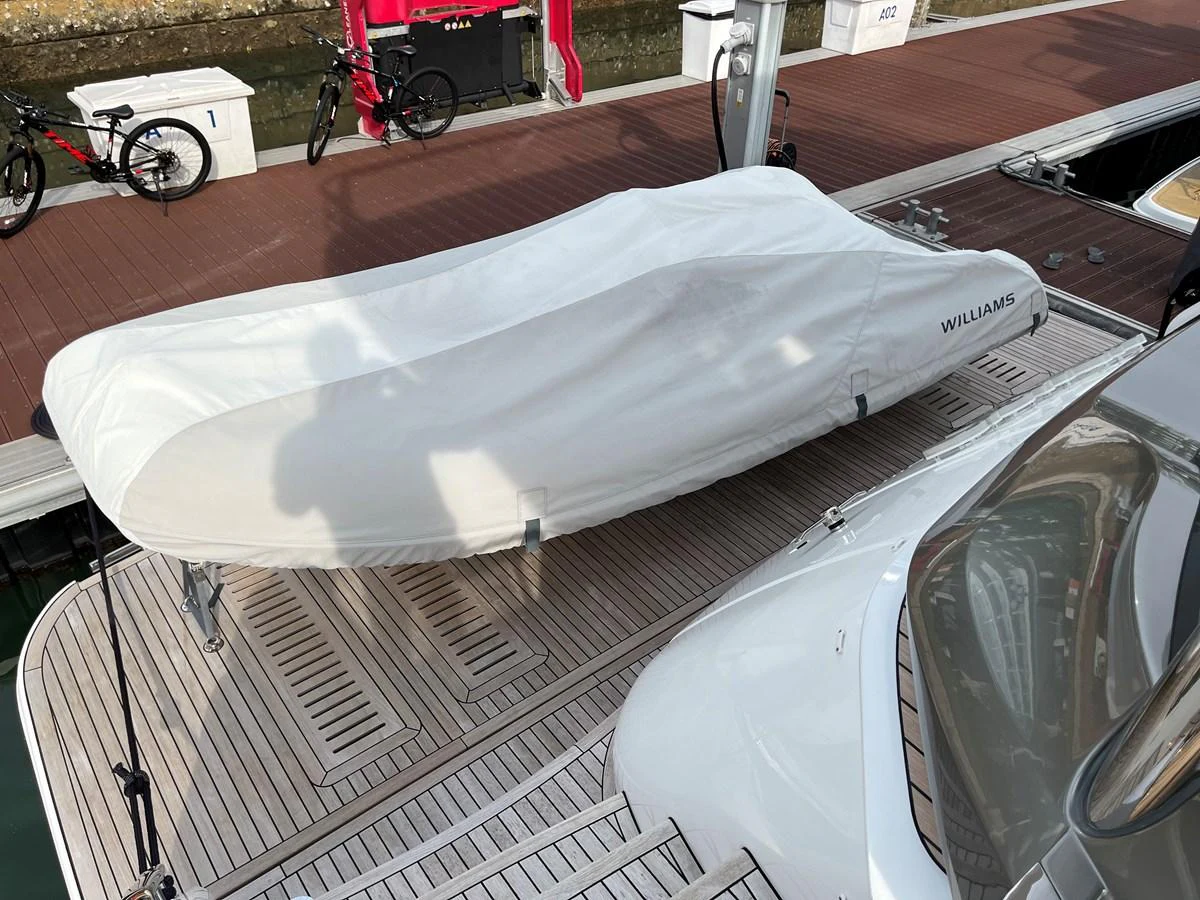 A covered tender is securely placed on the yacht's deck, ready for use. aboard LILYAN Yacht for Sale