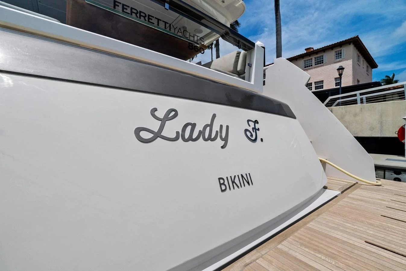 Close-up of the yacht's stern showcasing its name and home port. aboard LADY F Yacht for Sale