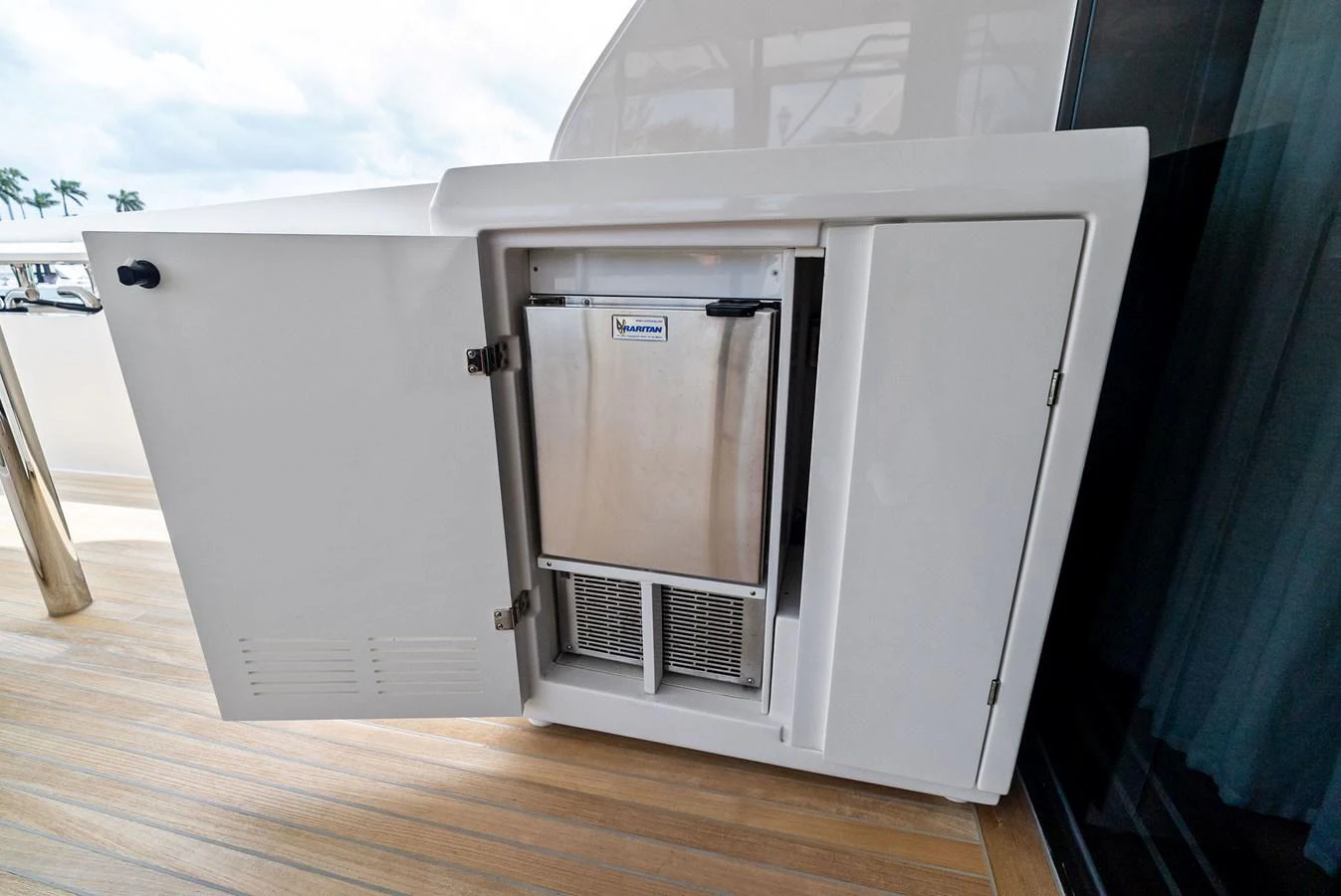 A sleek built-in refrigerator is integrated into the yacht's deck area, offering convenient access to refreshments. aboard LADY F Yacht for Sale