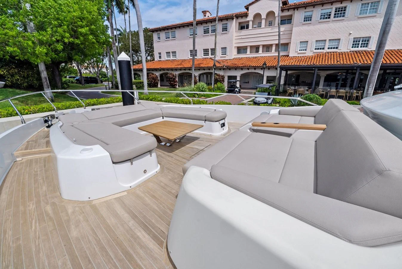 The foredeck features spacious seating with plush cushions and a central table, perfect for relaxation and socializing. aboard LADY F Yacht for Sale