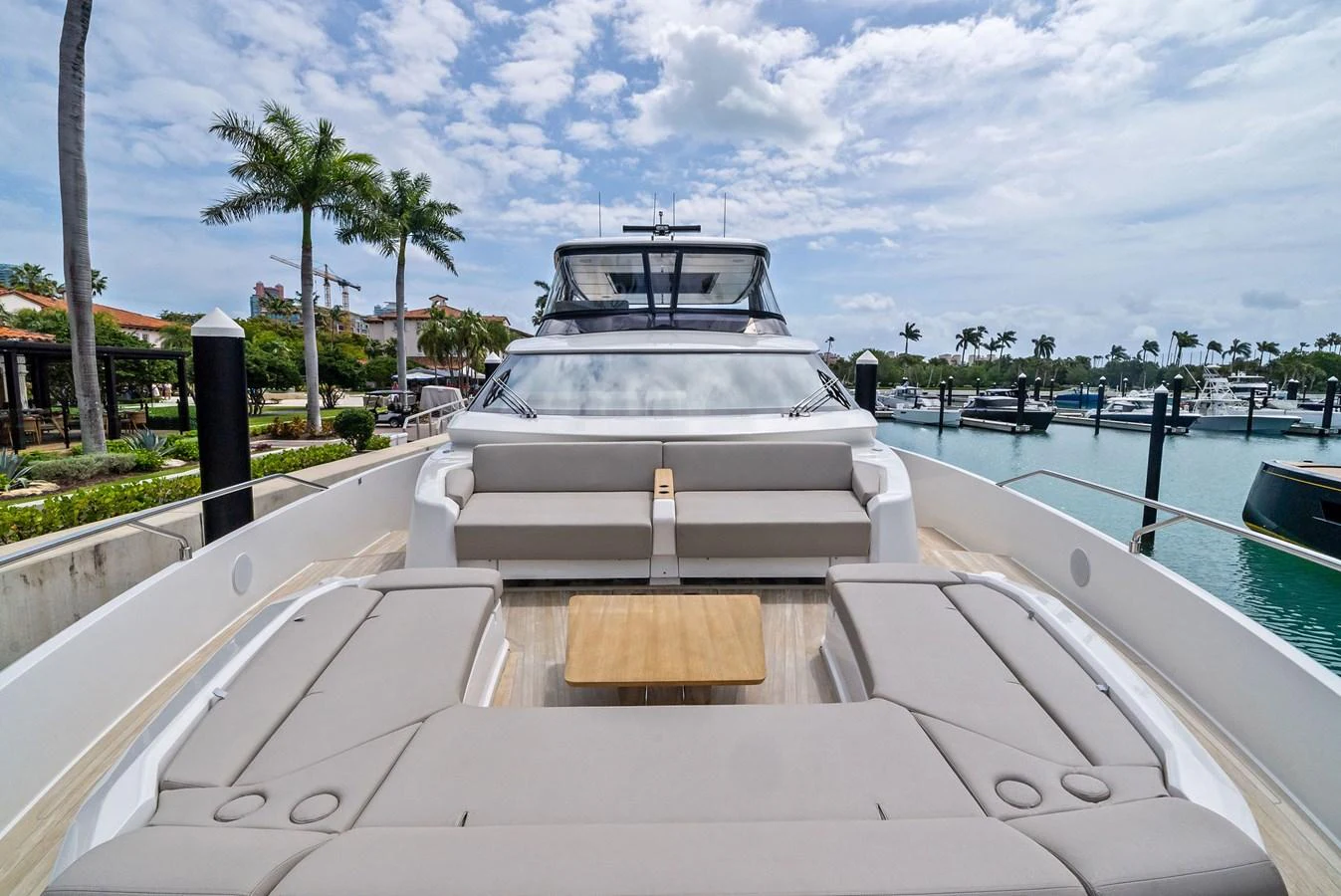 The foredeck features spacious sunpads and a central table, perfect for relaxation and socializing. aboard LADY F Yacht for Sale
