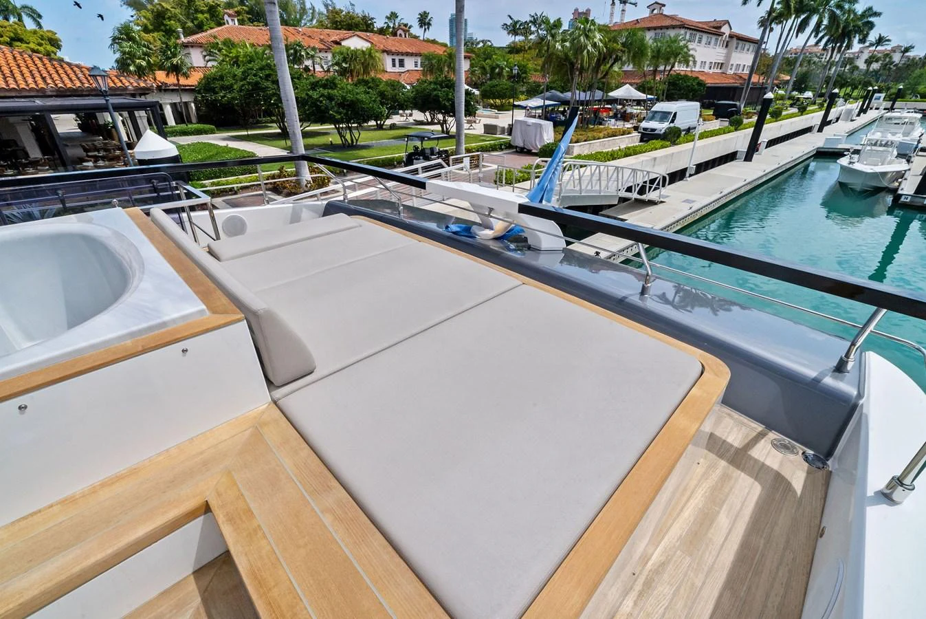 The sundeck offers a luxurious lounging area with a view of the marina. aboard LADY F Yacht for Sale
