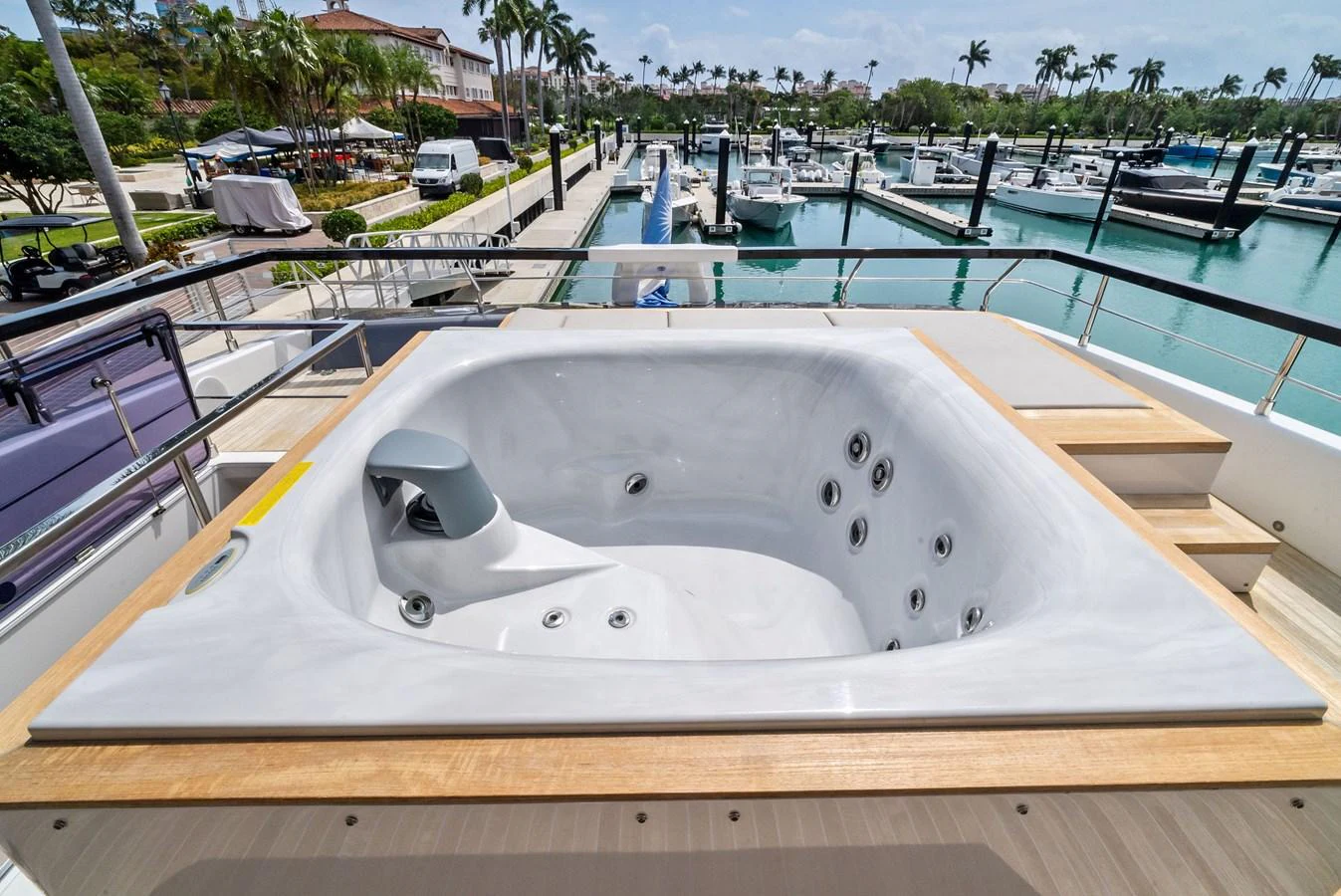 The yacht features a luxurious jacuzzi on the deck, perfect for relaxation with a stunning marina view. aboard LADY F Yacht for Sale