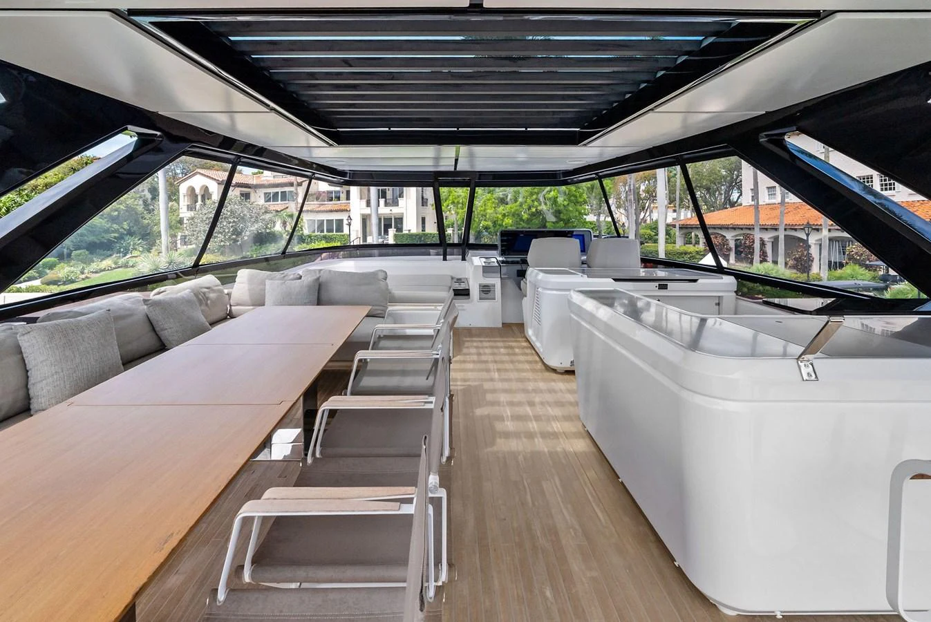 The spacious salon features a modern design with ample seating and large windows for panoramic views. aboard LADY F Yacht for Sale