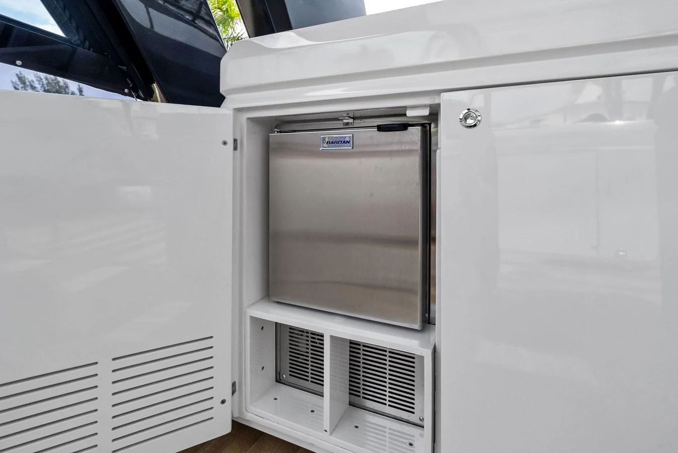 The image showcases a built-in refrigerator unit within the yacht's sleek cabinetry. aboard LADY F Yacht for Sale