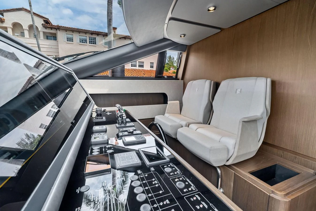 The helm station features advanced navigation equipment and comfortable seating, offering a sophisticated command center. aboard LADY F Yacht for Sale