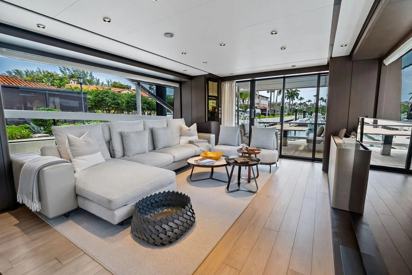 The yacht's salon features a spacious and modern seating area with large windows offering scenic views. aboard LADY F Yacht for Sale
