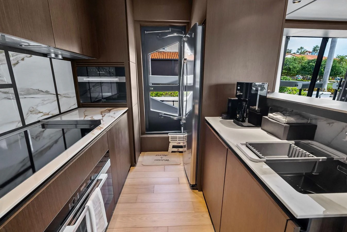 The galley features modern appliances and ample counter space, perfect for gourmet meal preparation. aboard LADY F Yacht for Sale