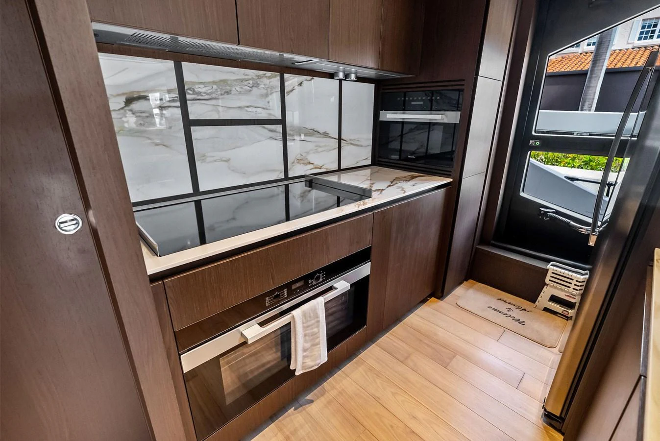 The galley features modern appliances and sleek cabinetry, offering a stylish and functional space for meal preparation. aboard LADY F Yacht for Sale