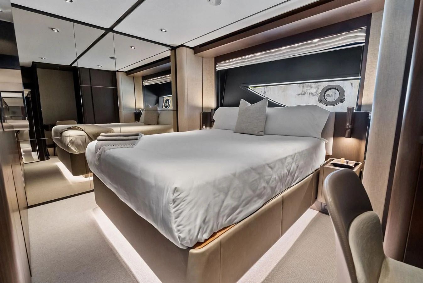 A luxurious stateroom with a large bed and elegant decor. aboard LADY F Yacht for Sale