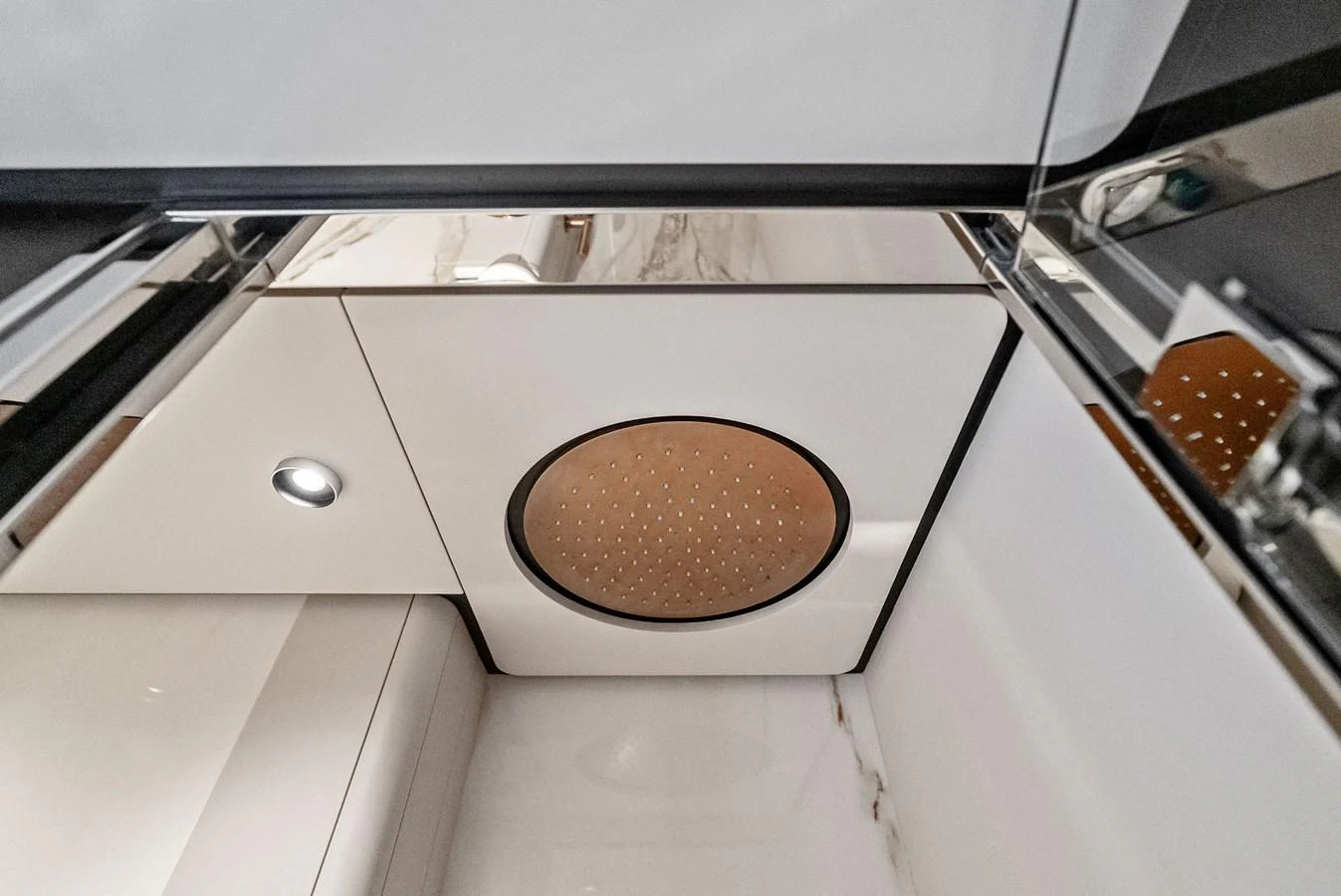 The image showcases a modern yacht shower with sleek, minimalist design elements. aboard LADY F Yacht for Sale