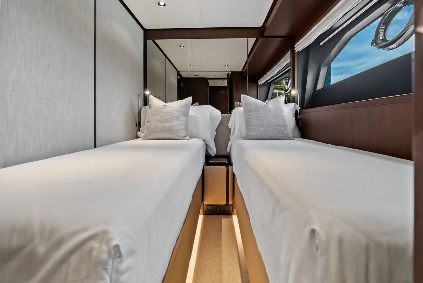 The twin stateroom offers a cozy and modern sleeping arrangement with two single beds and elegant decor. aboard LADY F Yacht for Sale