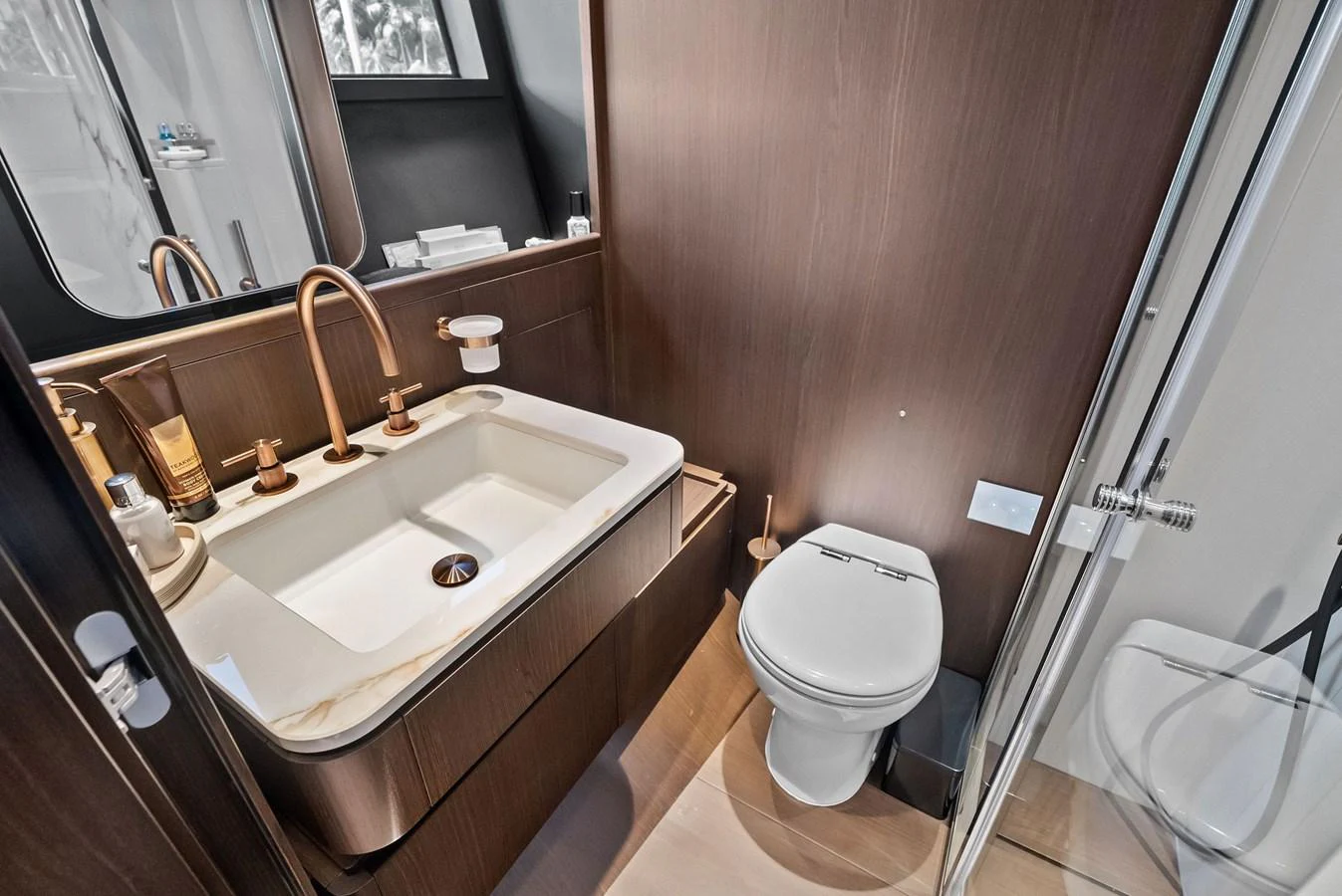 The yacht's bathroom features modern fixtures and a sleek design. aboard LADY F Yacht for Sale