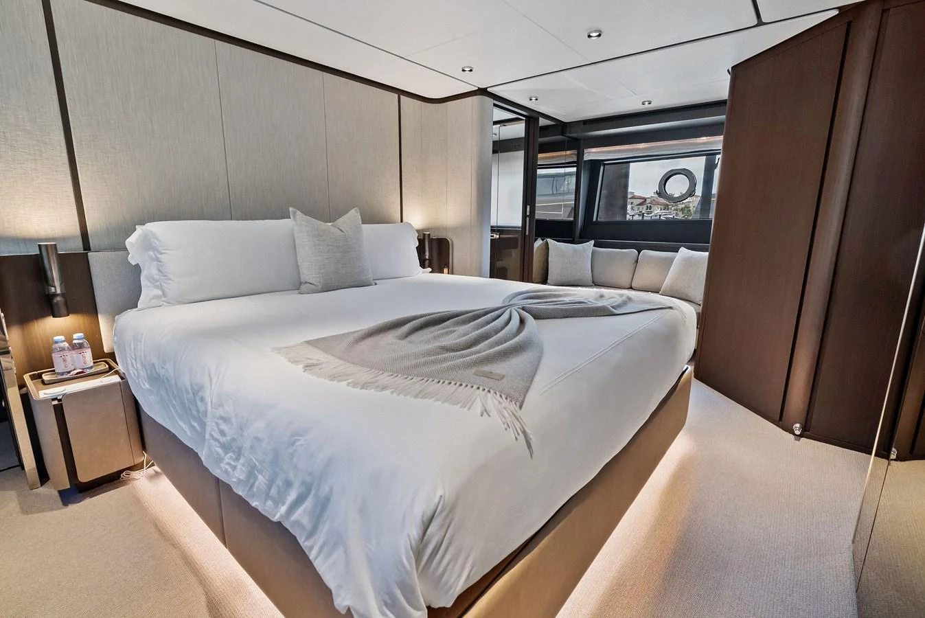 The master stateroom features a luxurious bed with elegant bedding and modern decor. aboard LADY F Yacht for Sale