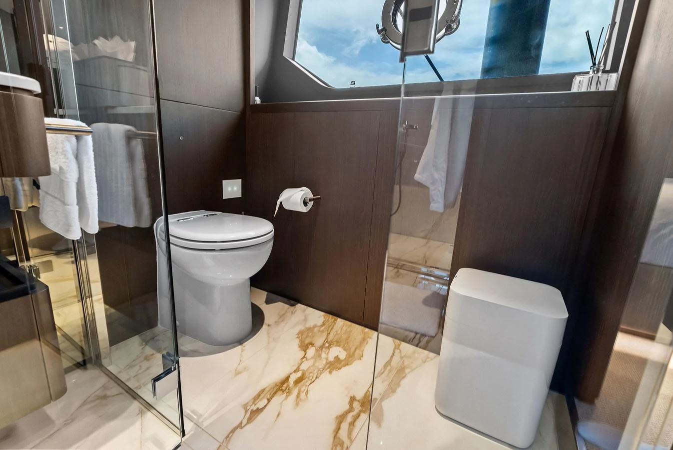A modern yacht bathroom with elegant fixtures and a large window. aboard LADY F Yacht for Sale