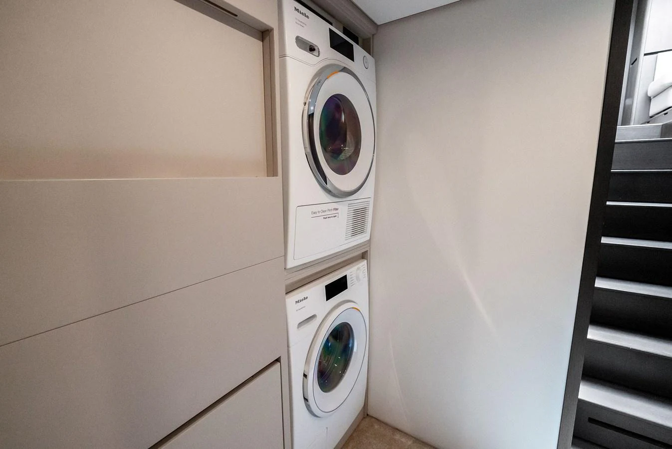 The yacht features a convenient laundry room with modern appliances. aboard LADY F Yacht for Sale