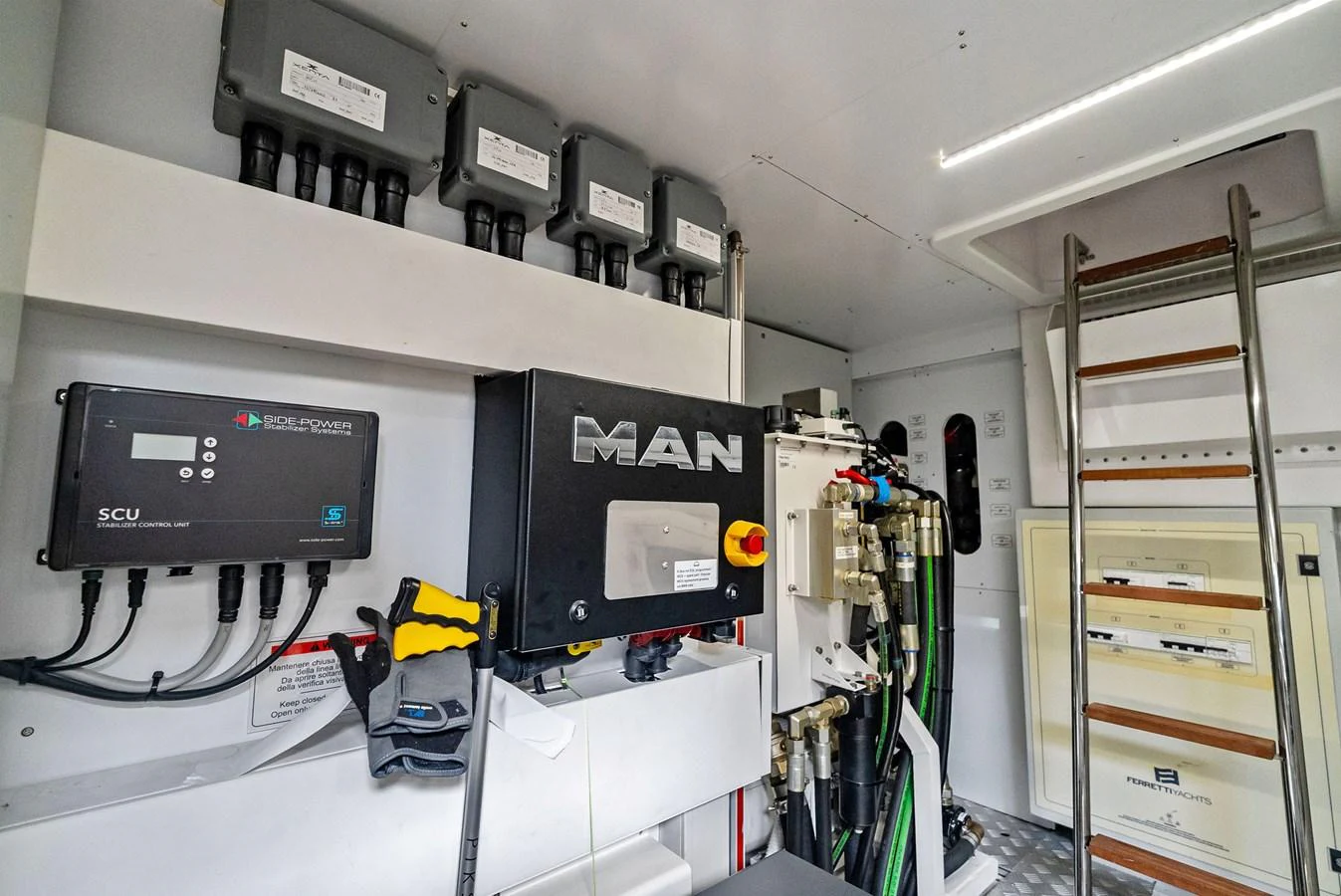 The image showcases the well-organized engine room of the yacht, featuring advanced machinery and equipment. aboard LADY F Yacht for Sale