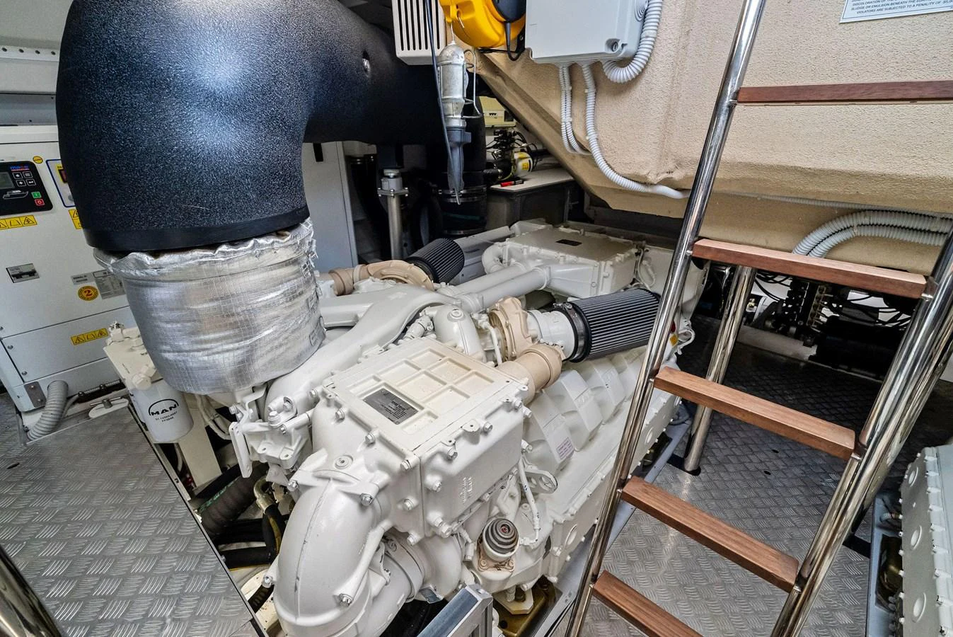 The image showcases the well-maintained engine room of the yacht, highlighting its powerful machinery. aboard LADY F Yacht for Sale