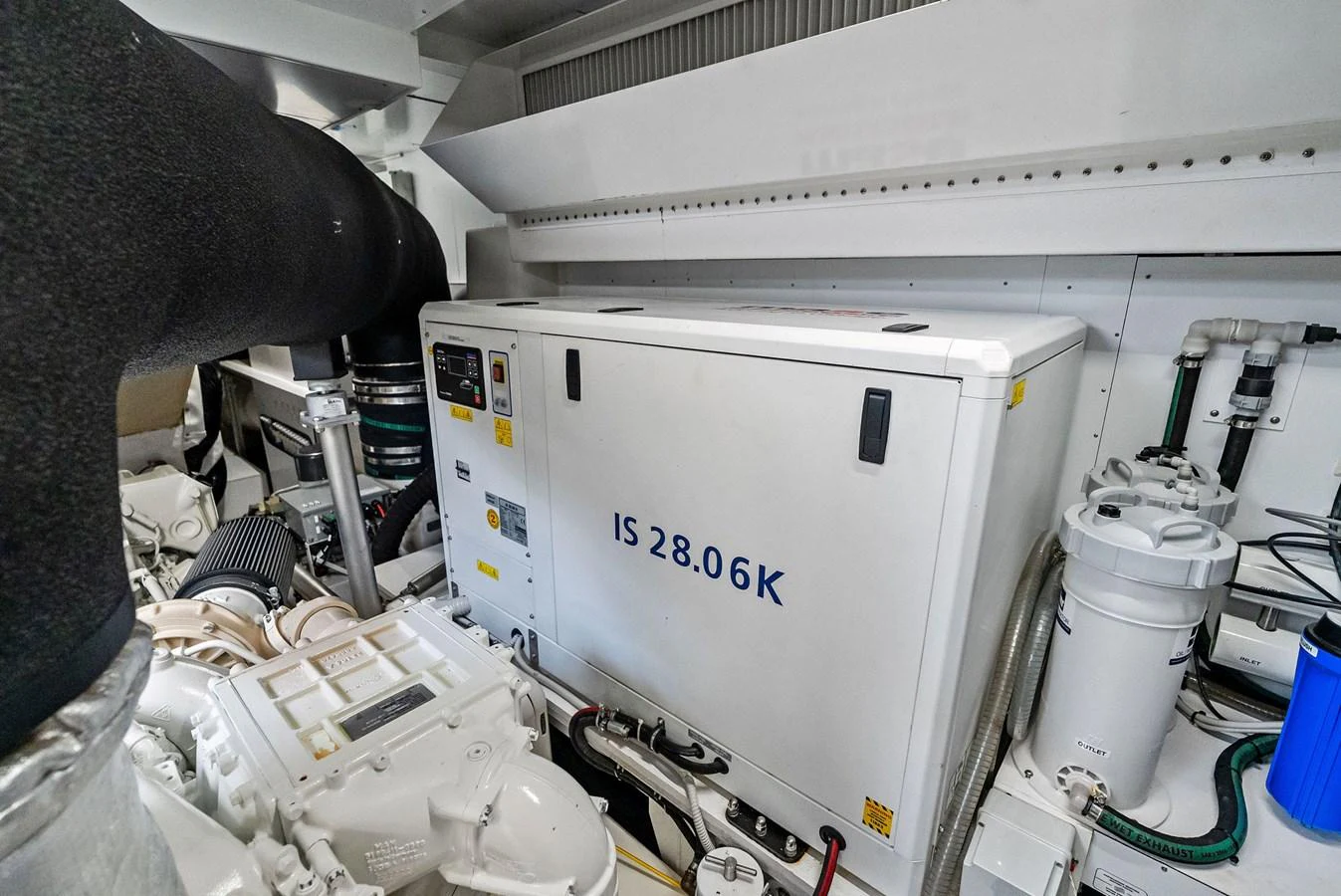 The image showcases the yacht's engine room with a focus on the generator and surrounding machinery. aboard LADY F Yacht for Sale