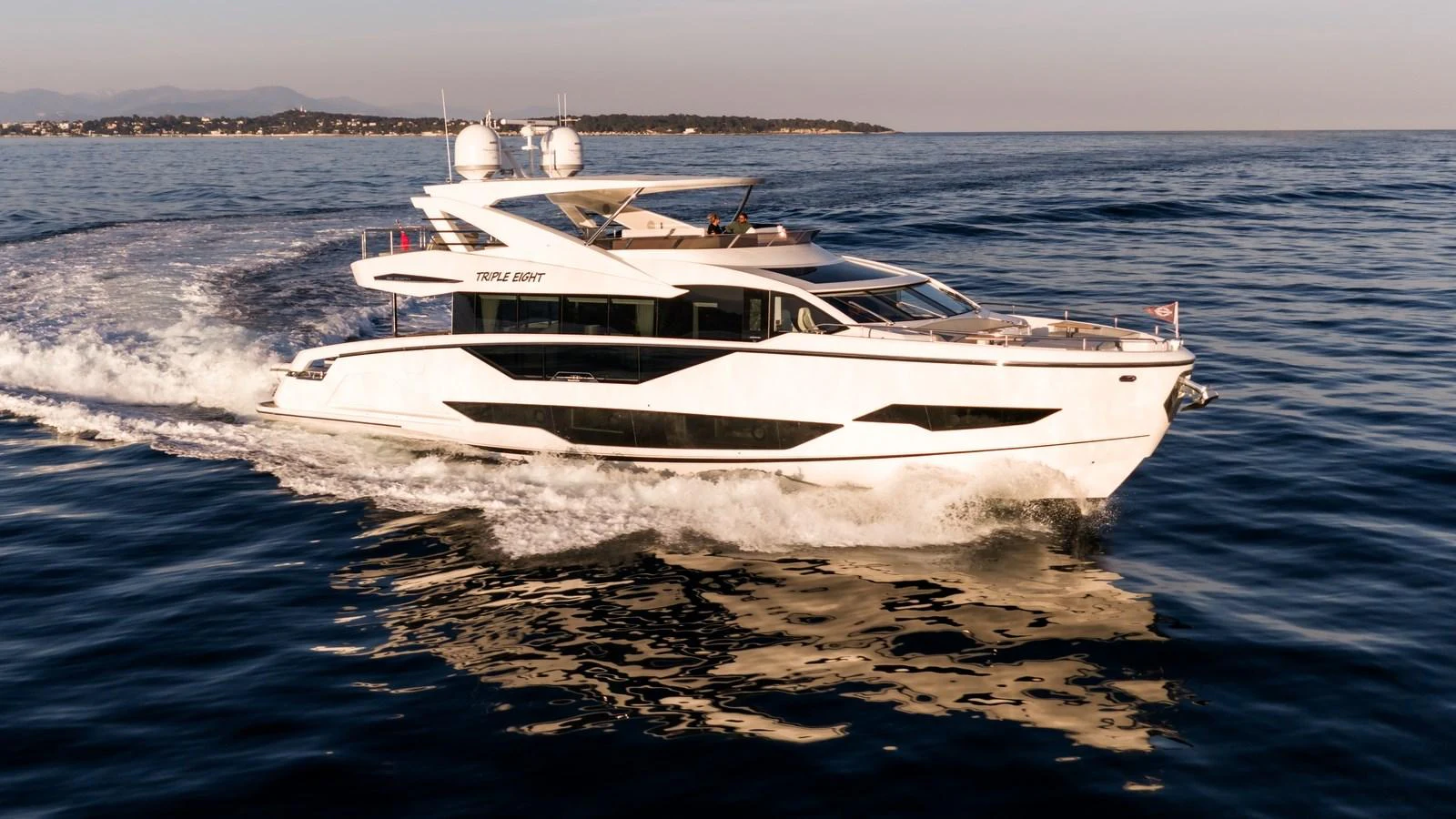 A sleek and modern yacht glides effortlessly across the calm waters, showcasing its elegant design and luxurious features. aboard TRIPLE EIGHT Yacht for Sale