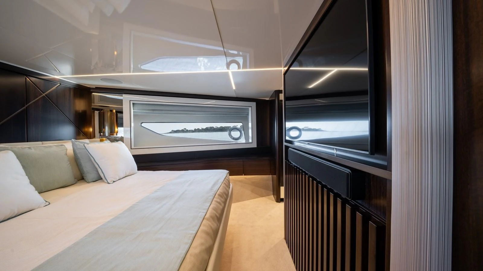 A luxurious stateroom featuring a large bed, modern decor, and ample natural light from the windows. aboard TRIPLE EIGHT Yacht for Sale