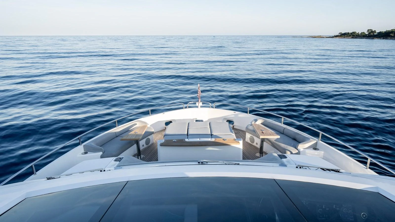 The yacht's bow offers a serene and spacious area for relaxation with stunning ocean views. aboard TRIPLE EIGHT Yacht for Sale