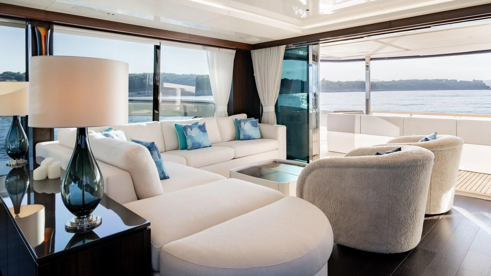 The salon offers a spacious and elegant seating area with panoramic views of the surrounding waters. aboard TRIPLE EIGHT Yacht for Sale