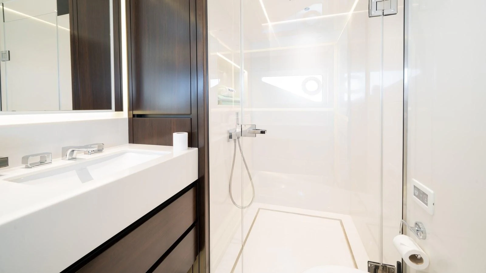 A sleek and modern yacht bathroom with a spacious shower and elegant fixtures. aboard TRIPLE EIGHT Yacht for Sale