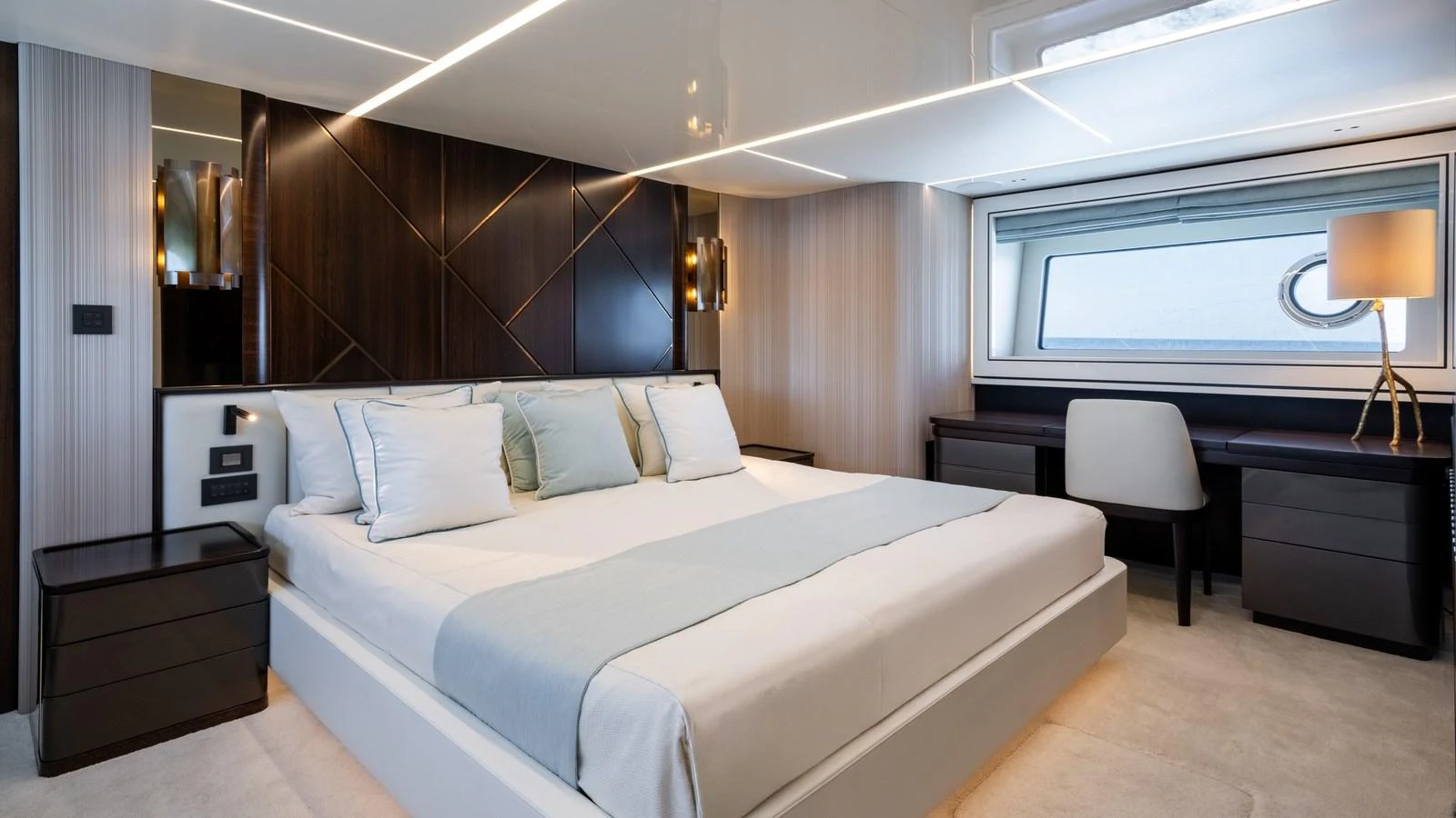 The master stateroom features a luxurious bed with elegant bedding and modern furnishings. aboard TRIPLE EIGHT Yacht for Sale