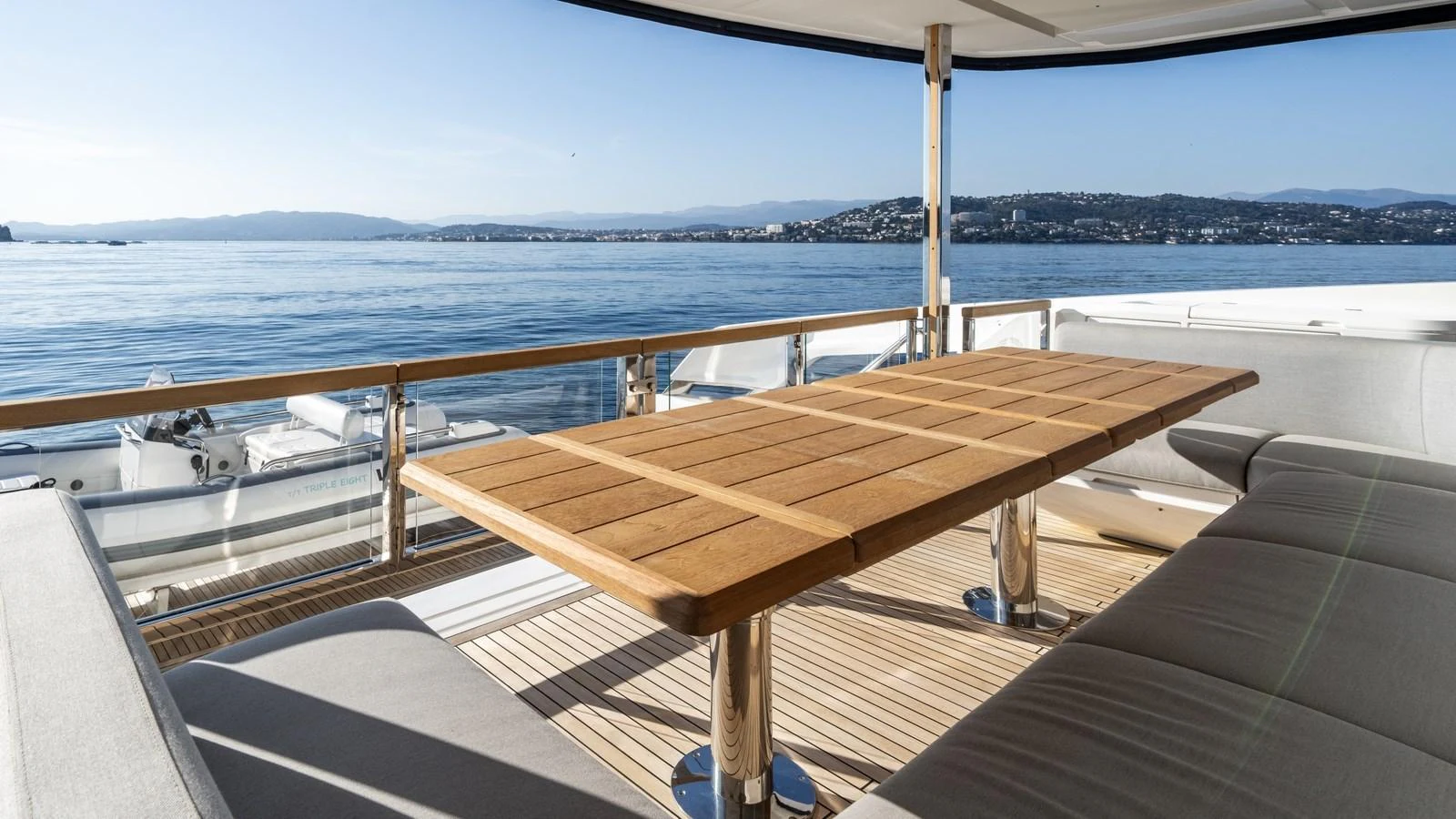 The aft deck offers a spacious and serene dining area with stunning sea views. aboard TRIPLE EIGHT Yacht for Sale