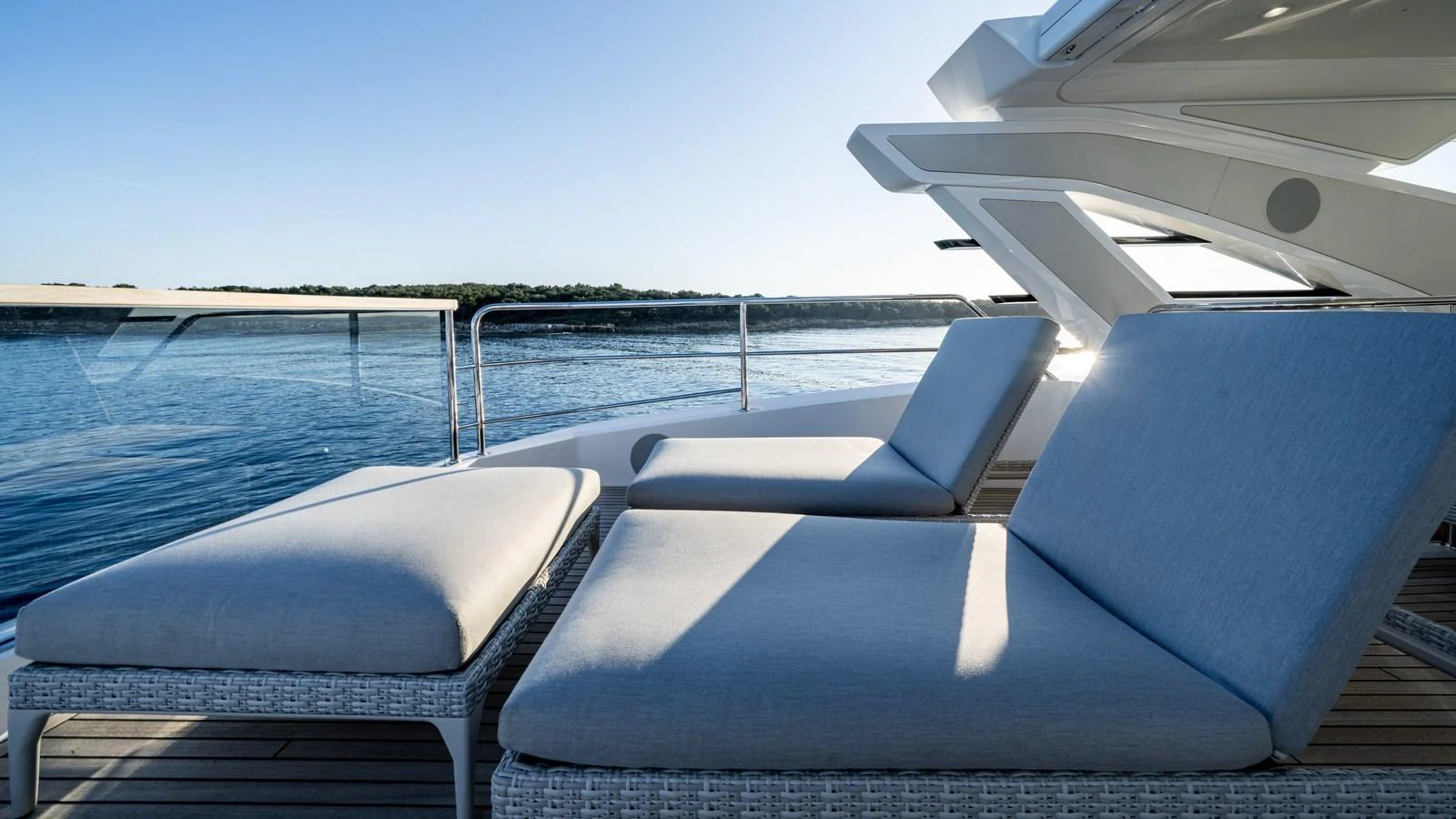 The sundeck features comfortable lounge chairs with a stunning view of the water. aboard TRIPLE EIGHT Yacht for Sale
