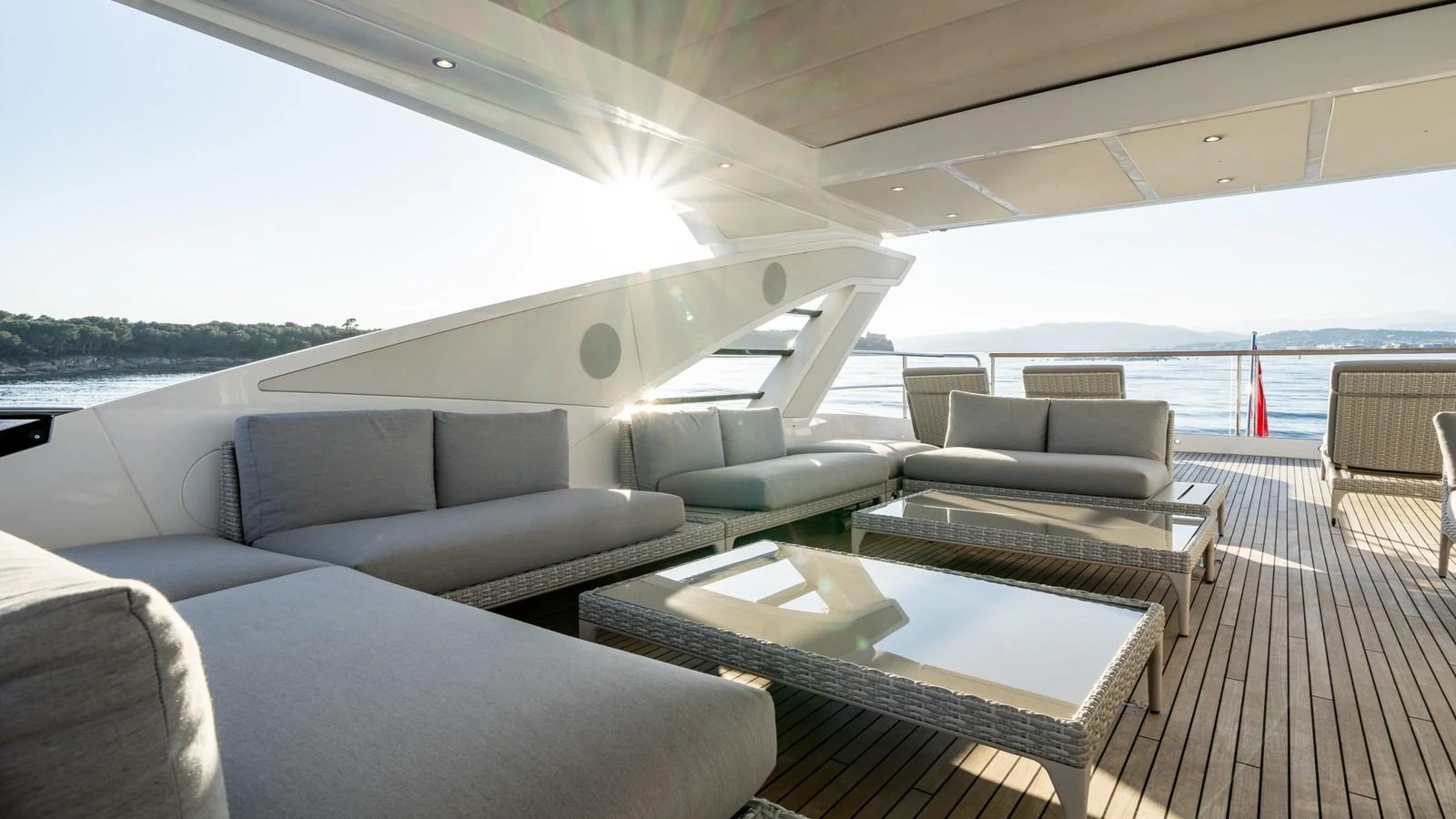 The aft deck features luxurious seating with a stunning view of the water, perfect for relaxation. aboard TRIPLE EIGHT Yacht for Sale