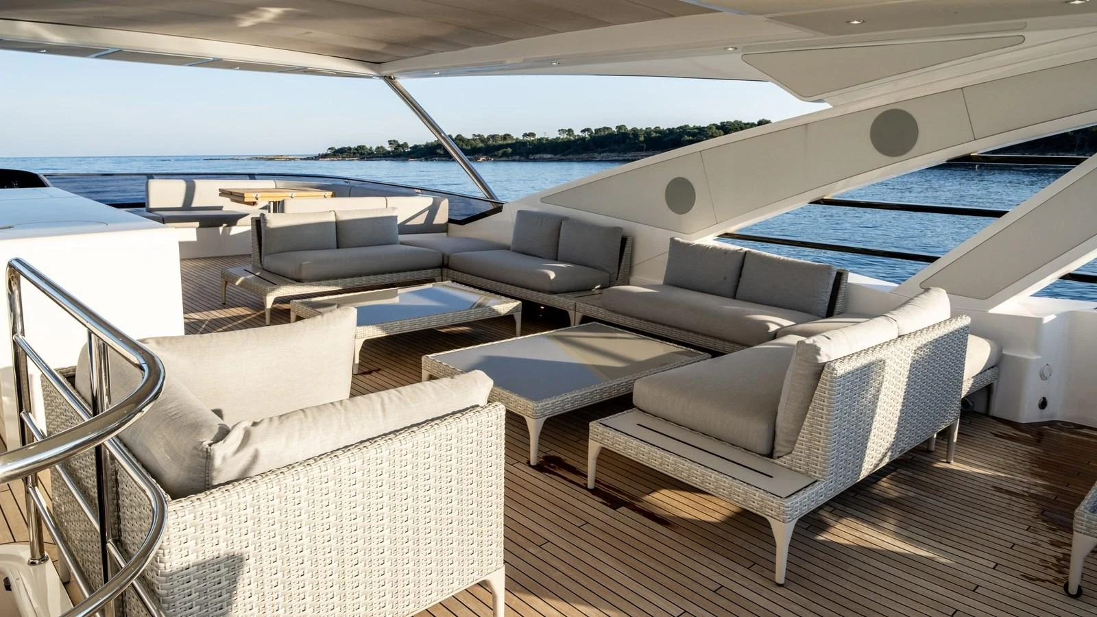 The sundeck features a luxurious seating area with comfortable sofas and a stunning view of the sea. aboard TRIPLE EIGHT Yacht for Sale
