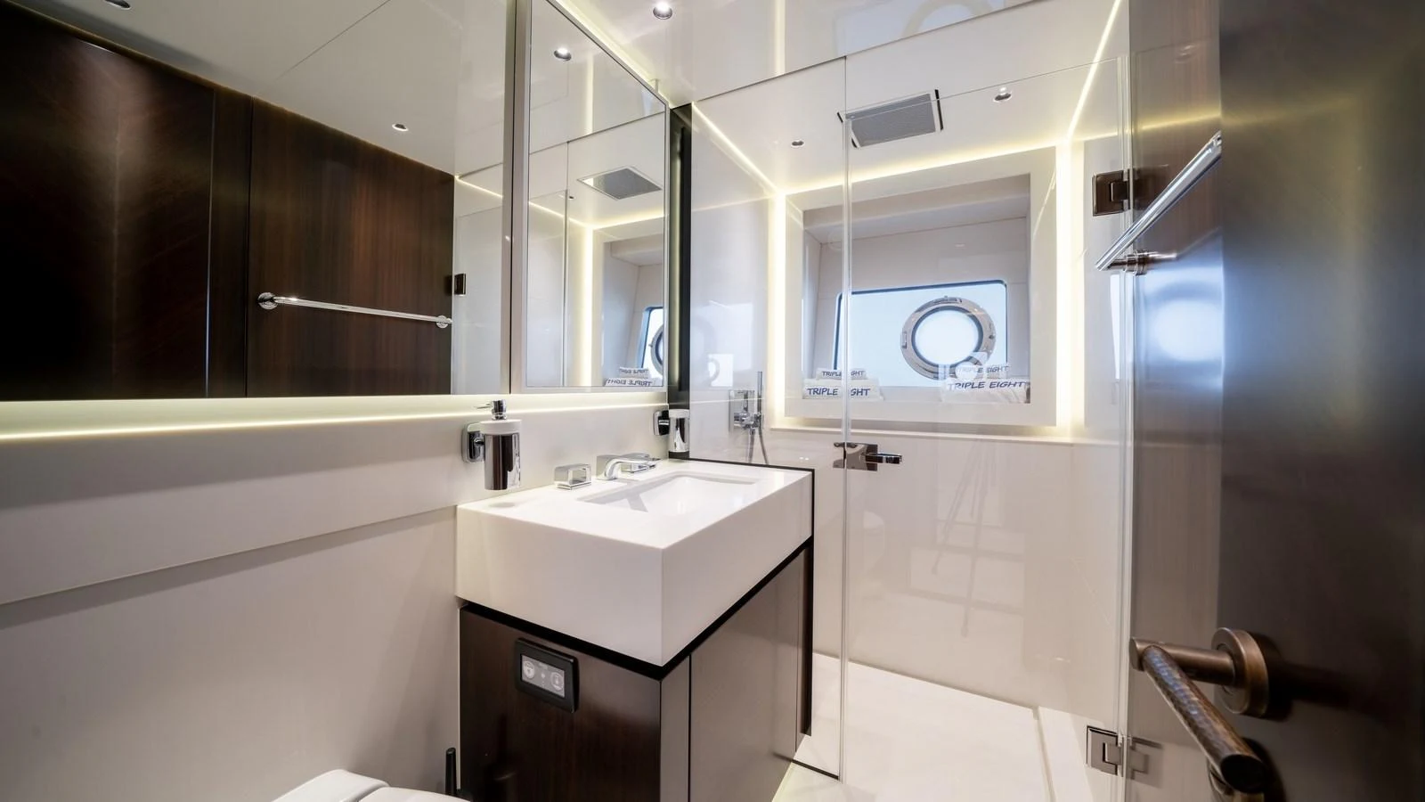 The yacht's bathroom features modern fixtures and a sleek design with ample lighting. aboard TRIPLE EIGHT Yacht for Sale