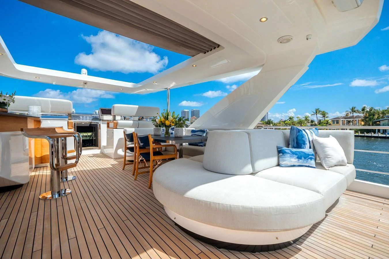 The sundeck offers a luxurious lounging area with plush seating and a bar, perfect for relaxation and entertainment. aboard PIER PRESSURE Yacht for Sale