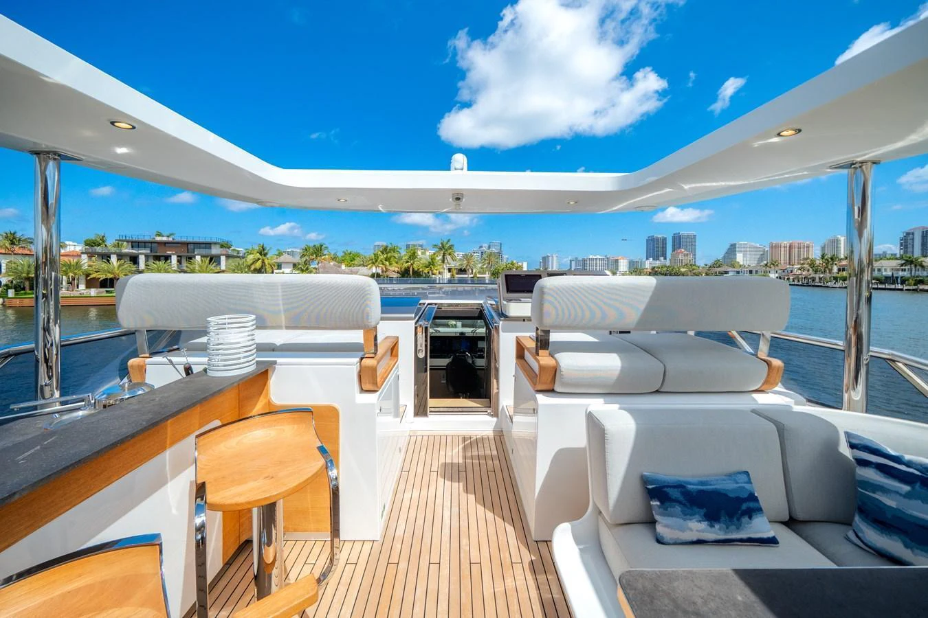 The flybridge offers a spacious and luxurious outdoor area with comfortable seating and stunning views. aboard PIER PRESSURE Yacht for Sale