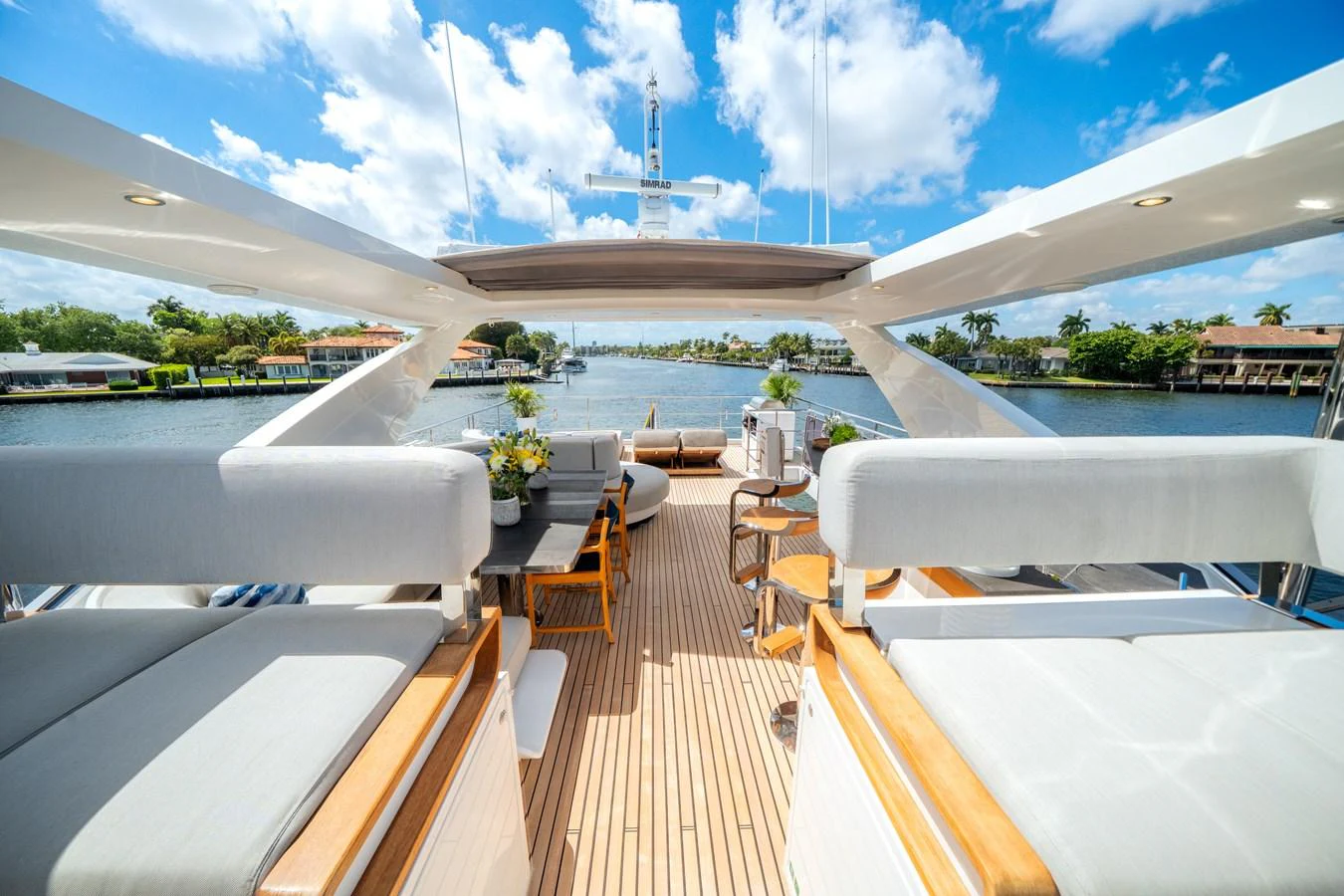 The flybridge offers a spacious and inviting area with comfortable seating and stunning views. aboard PIER PRESSURE Yacht for Sale