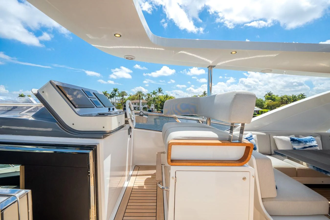 The flybridge offers a luxurious outdoor seating area with modern amenities and stunning views. aboard PIER PRESSURE Yacht for Sale