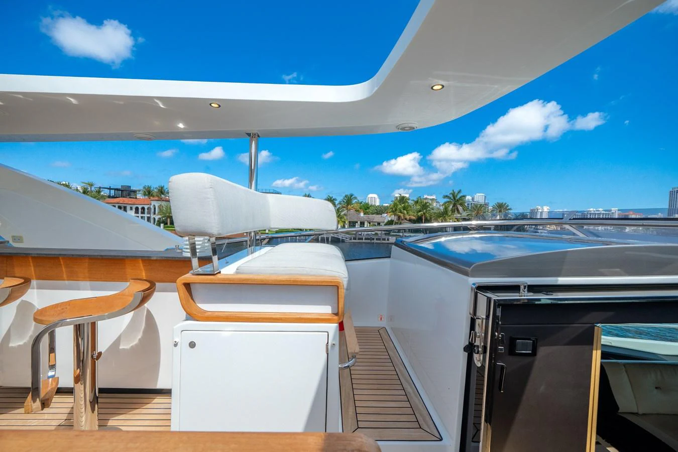 The flybridge offers a spacious and inviting area with comfortable seating and a stunning view of the surroundings. aboard PIER PRESSURE Yacht for Sale
