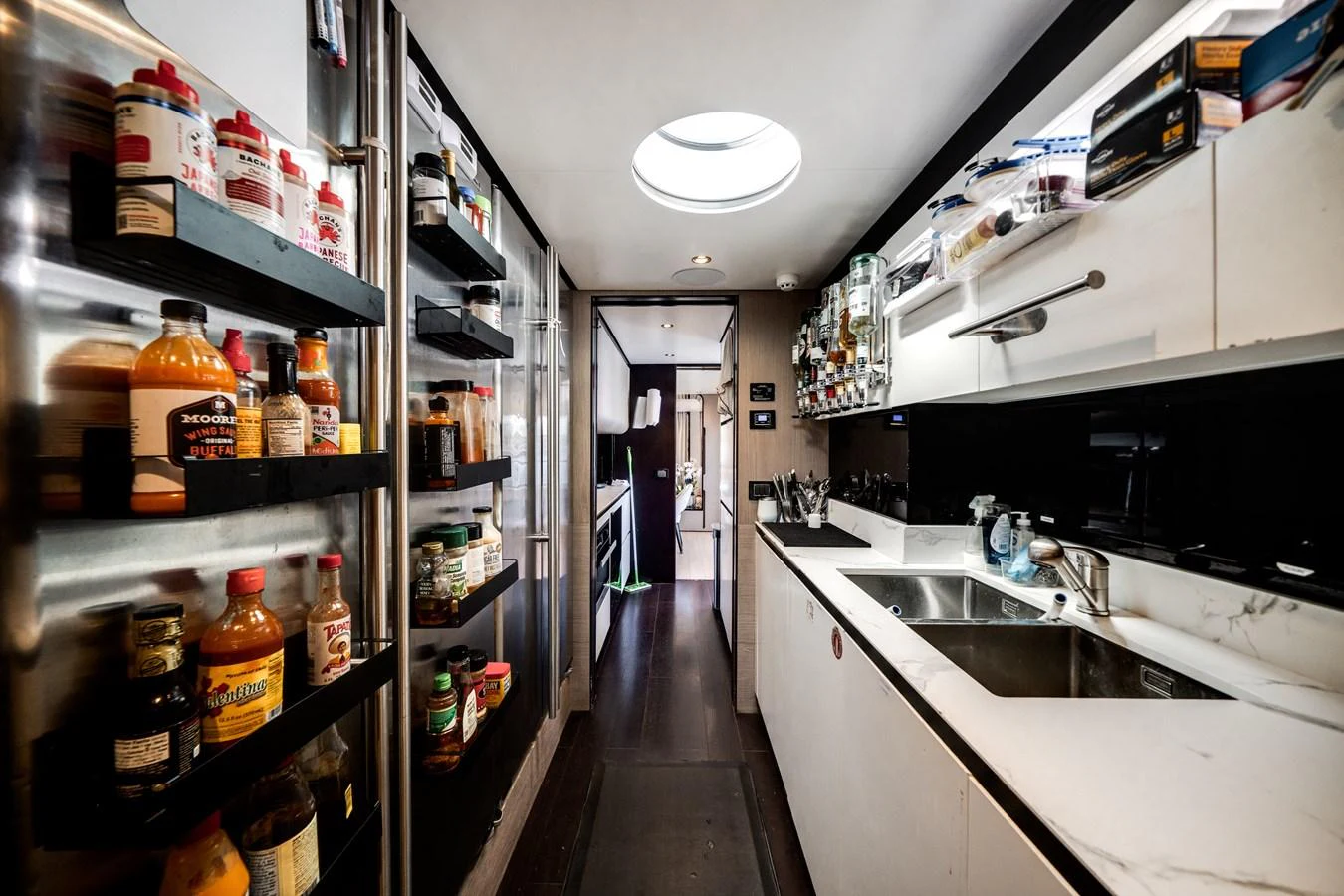 The galley is well-equipped with modern appliances and ample storage, perfect for gourmet meal preparation. aboard PIER PRESSURE Yacht for Sale