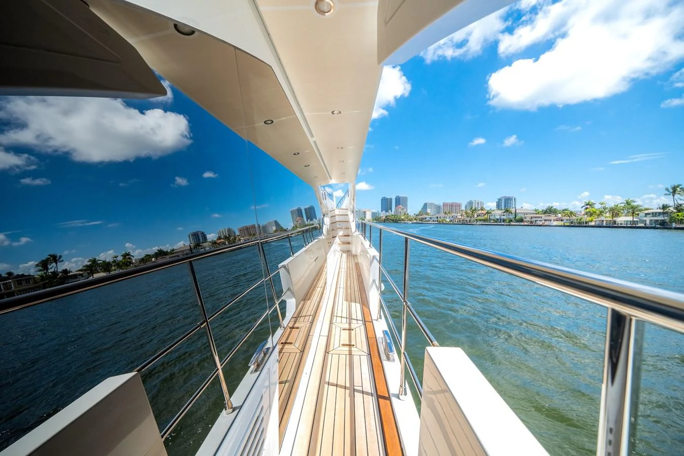 A sleek side deck with polished railings and a beautiful water view. aboard PIER PRESSURE Yacht for Sale