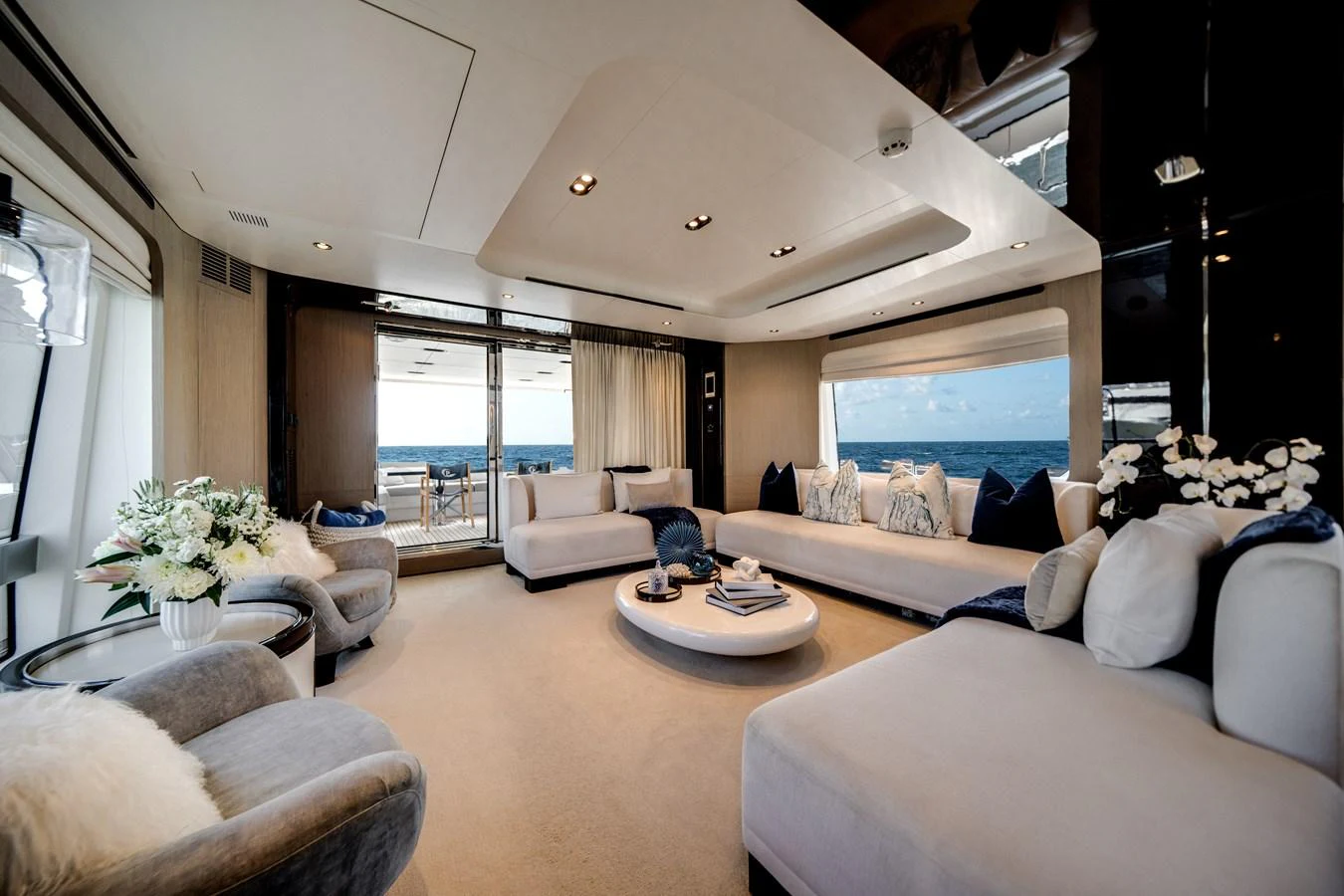 The salon offers a spacious and elegant area with plush seating and panoramic views. aboard PIER PRESSURE Yacht for Sale